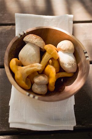 porcini mushroom - Chanterelles and ceps in wooden bowl Stock Photo - Premium Royalty-Free, Code: 659-02212248