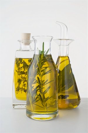 Three different herb oils in bottles Stock Photo - Premium Royalty-Free, Code: 659-02212281