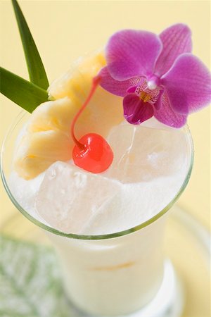 pina - Piña Colada with pineapple, cocktail cherry and orchid Stock Photo - Premium Royalty-Free, Code: 659-02212399