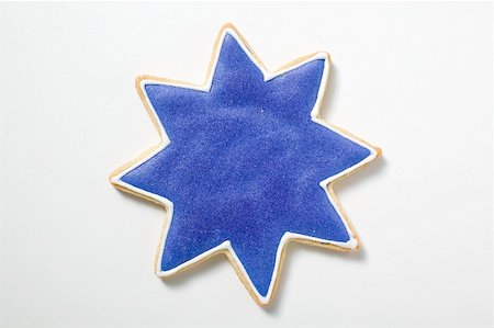 simsearch:659-02213086,k - Un cookie étoile avec glaçage bleu Photographie de stock - Premium Libres de Droits, Code: 659-02212488