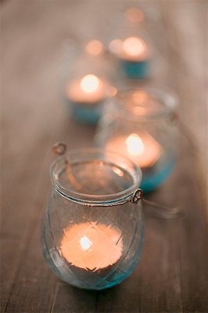 Windlights on wooden table Stock Photo - Premium Royalty-Free, Code: 659-02212617