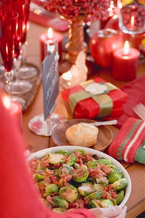 simsearch:659-02212906,k - Woman serving Brussels sprouts with bacon (Christmas) Stock Photo - Premium Royalty-Free, Code: 659-02212898