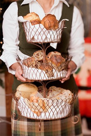 simsearch:659-02212898,k - Woman holding tiered stand full of baked goods (Christmas) Stock Photo - Premium Royalty-Free, Code: 659-02212891
