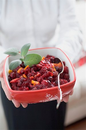 simsearch:659-02212898,k - Woman holding dish of cranberry sauce Stock Photo - Premium Royalty-Free, Code: 659-02212907