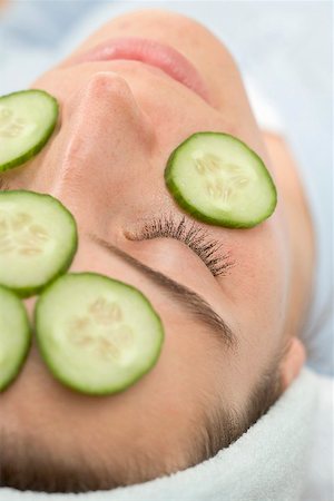 Woman with slices of fresh cucumber on her face Stock Photo - Premium Royalty-Free, Code: 659-02212945