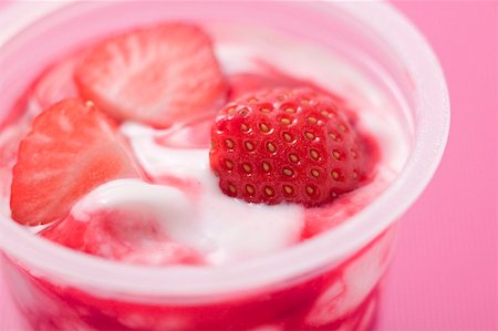 strawberry in yogurt - Strawberry yoghurt in plastic pot Stock Photo - Premium Royalty-Free, Code: 659-02213315