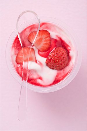 simsearch:659-03524866,k - Strawberry yoghurt in plastic pot with spoon (overhead view) Stock Photo - Premium Royalty-Free, Code: 659-02213318