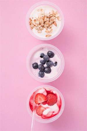 fruits in plastic cups - Strawberry yoghurt, blueberry yoghurt & yoghurt with cereal Stock Photo - Premium Royalty-Free, Code: 659-02213323