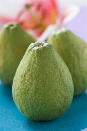 simsearch:659-03524928,k - Three guavas, orchid in background Stock Photo - Premium Royalty-Free, Code: 659-02213419