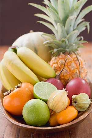 fruitbowl - Exotic fruit and citrus fruit in wooden bowl Stock Photo - Premium Royalty-Free, Code: 659-02213438