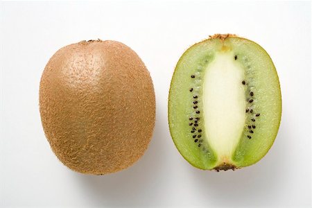 simsearch:659-02213612,k - Whole kiwi fruit & half a kiwi fruit (longitudinal section) Stock Photo - Premium Royalty-Free, Code: 659-02213454