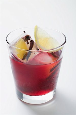 simsearch:659-03529205,k - Red wine punch in glass with ice cubes and lemon Stock Photo - Premium Royalty-Free, Code: 659-02213494