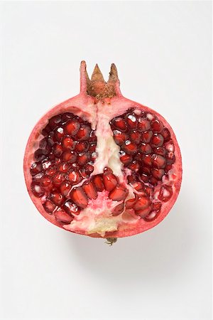 simsearch:659-02213595,k - Half a pomegranate (overhead view) Stock Photo - Premium Royalty-Free, Code: 659-02213523