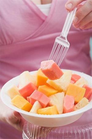 simsearch:659-03522723,k - Woman eating exotic fruit salad Stock Photo - Premium Royalty-Free, Code: 659-02213548