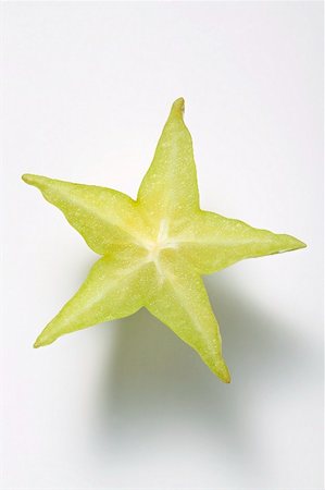 Slice of carambola Stock Photo - Premium Royalty-Free, Code: 659-02213587