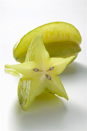 star fruit - Whole carambolas and half a carambola Stock Photo - Premium Royalty-Free, Code: 659-02213581