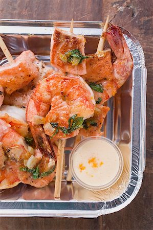 shrimp kebab - Salmon & prawn skewers with mint & sauce in aluminium dish Stock Photo - Premium Royalty-Free, Code: 659-02213686