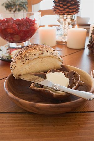 Poppy seed roll and butter on Christmas table (USA) Stock Photo - Premium Royalty-Free, Code: 659-02213760