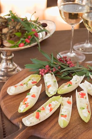 Chicory boats filled with soft cheese (Christmas) Fotografie stock - Premium Royalty-Free, Codice: 659-02213828