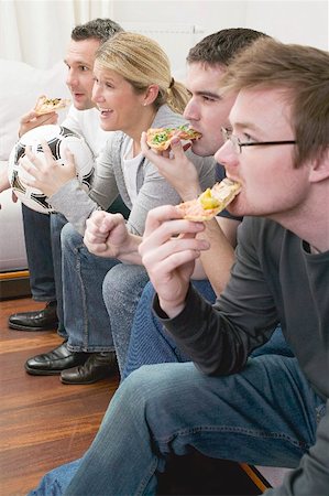 eating and tv - Friends with pizza and football watching Stock Photo - Premium Royalty-Free, Code: 659-02213872