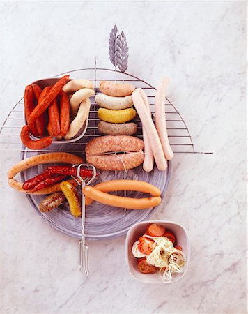 A selection of raw and grilled sausages Stock Photo - Premium Royalty-Free, Code: 659-03524032