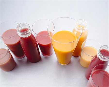 Various smoothies in plastic bottles and glasses Stock Photo - Premium Royalty-Free, Code: 659-03524043