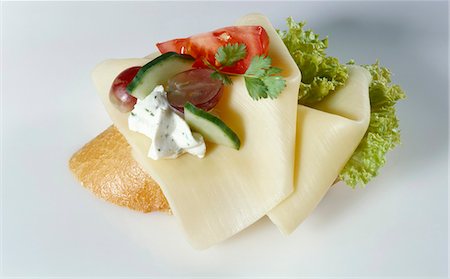 Slices of cheese on baguette Stock Photo - Premium Royalty-Free, Code: 659-03524202