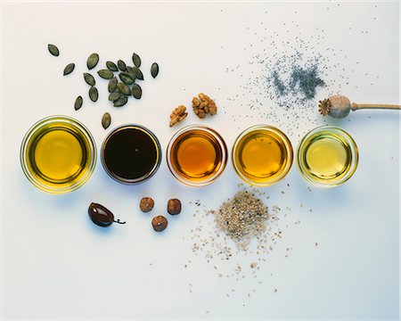 fat product - Various types of oil with the raw ingredients Stock Photo - Premium Royalty-Free, Code: 659-03524223