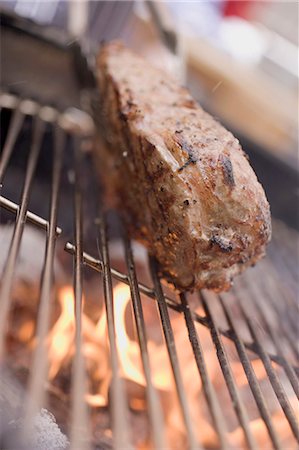 steak bbq flame - Beef steak on barbecue Stock Photo - Premium Royalty-Free, Code: 659-03524308