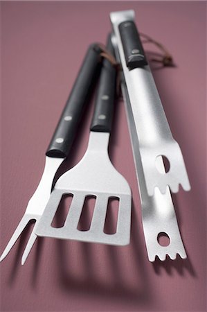 Barbecue tools (tongs, spatula, carving fork) Stock Photo - Premium Royalty-Free, Code: 659-03524321