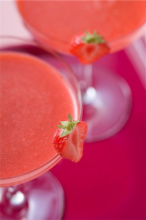 simsearch:659-01854130,k - Two glasses of Strawberry Daiquiri on tray (detail) Stock Photo - Premium Royalty-Free, Code: 659-03524407