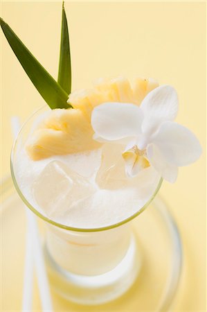 pina - Piña Colada with pineapple and white orchid Stock Photo - Premium Royalty-Free, Code: 659-03524403