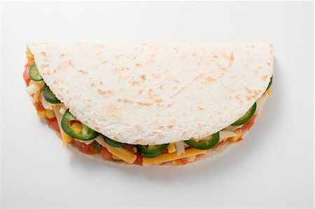 simsearch:659-08906080,k - Tortilla filled with salsa, chillies and cheese Foto de stock - Sin royalties Premium, Código: 659-03524487