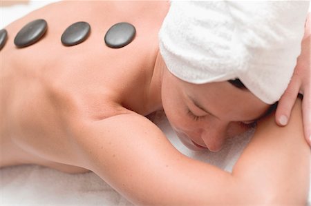 spa stone therapy - Woman having LaStone Therapy (healing therapy using stones) Stock Photo - Premium Royalty-Free, Code: 659-03524602