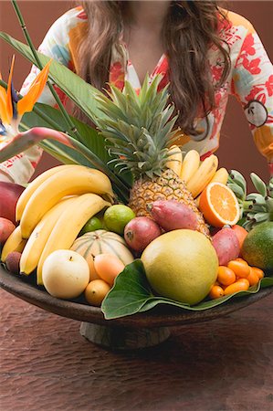 exotic fruit bowl - Woman holding bowl of exotic fruit Stock Photo - Premium Royalty-Free, Code: 659-03524709