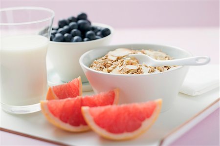 Muesli ingredients: cereal, yoghurt, blueberries, grapefruit Stock Photo - Premium Royalty-Free, Code: 659-03524730