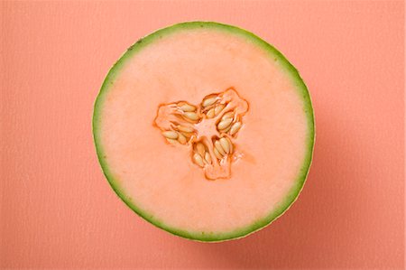 simsearch:659-01861549,k - Half a cantaloupe melon (overhead view) Stock Photo - Premium Royalty-Free, Code: 659-03524835