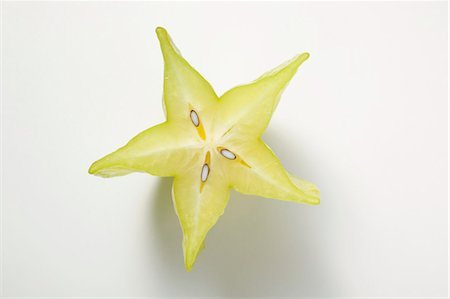 star fruit - Carambola, halved (overhead view) Stock Photo - Premium Royalty-Free, Code: 659-03524881