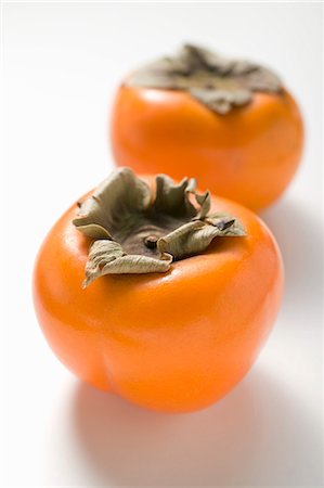 simsearch:659-01854611,k - Two persimmons Stock Photo - Premium Royalty-Free, Code: 659-03524923