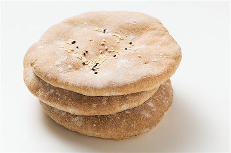simsearch:659-03530672,k - Flatbread with sesame seeds, stacked Stock Photo - Premium Royalty-Free, Code: 659-03525188