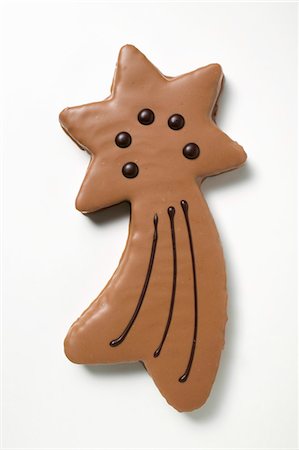 simsearch:659-01843402,k - Shooting star biscuit with chocolate icing Stock Photo - Premium Royalty-Free, Code: 659-03525230