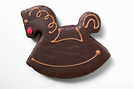 simsearch:659-01843402,k - Rocking horse biscuit with chocolate icing Stock Photo - Premium Royalty-Free, Code: 659-03525233