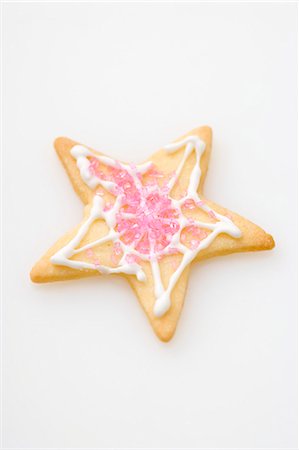 simsearch:659-01860688,k - Un biscuit étoile décoré de sucre rose Photographie de stock - Premium Libres de Droits, Code: 659-03525738