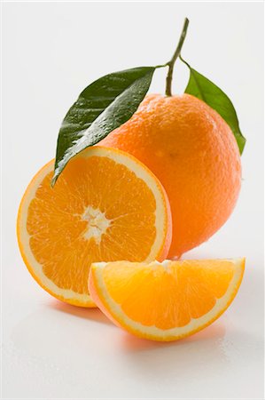 simsearch:659-02213540,k - Orange with stalk and leaf, orange half and wedge Stock Photo - Premium Royalty-Free, Code: 659-03525925