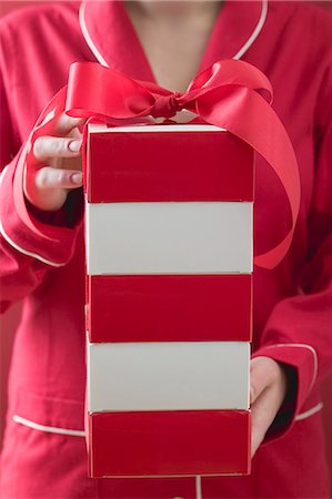 Woman holding Christmas parcel Stock Photo - Premium Royalty-Free, Code: 659-03526132