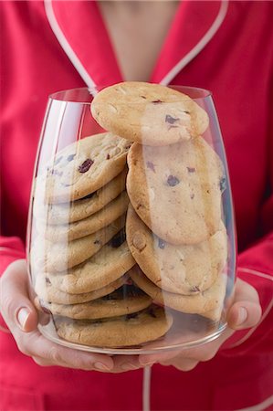 Woman holding glass full of cranberry cookies Stock Photo - Premium Royalty-Free, Code: 659-03526151