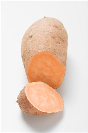 sweet potatoes raw - A sweet potato with a piece cut off Stock Photo - Premium Royalty-Free, Code: 659-03526286