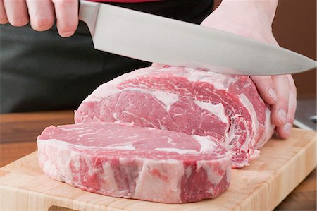 Slicing beef Stock Photo - Premium Royalty-Free, Code: 659-03526531