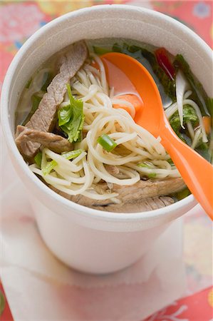 fast food soup - Asian noodle soup with beef in polystyrene cup Stock Photo - Premium Royalty-Free, Code: 659-03526585