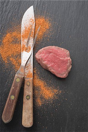 steak ingredients - Fillet steak, carving fork, knife and spice Stock Photo - Premium Royalty-Free, Code: 659-03526590